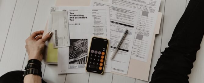 Tax calculator with receipts and laptop