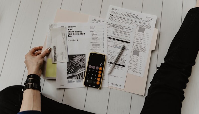 Tax calculator with receipts and laptop